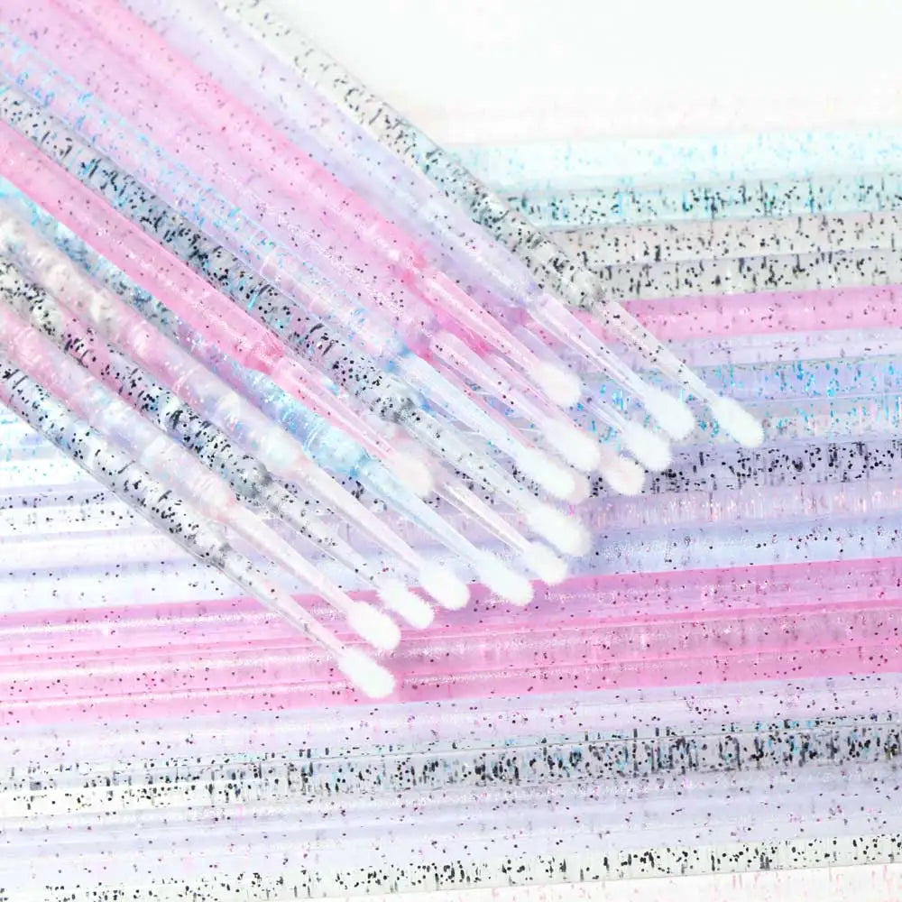 Closeup of Crystal Disposable Eyelash Brushes showing soft microbrush tips for gentle lash handling