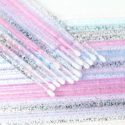 Closeup of Crystal Disposable Eyelash Brushes showing soft microbrush tips for gentle lash handling
